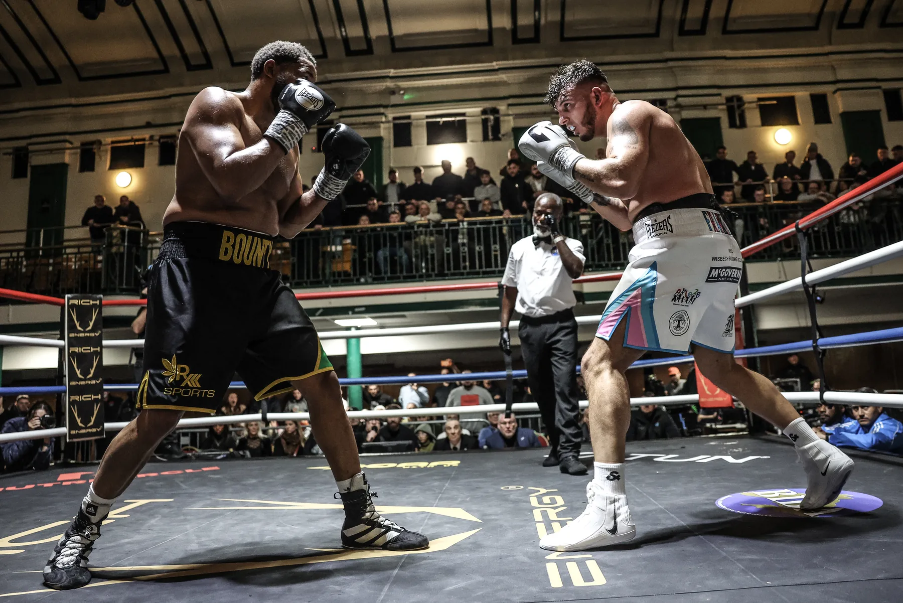 Heavyweight boxers squaring up with Rich Energy ringside